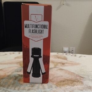 Multifunctional Flashlight -  5 Emergency Light Mode,  Charges Phones, USB